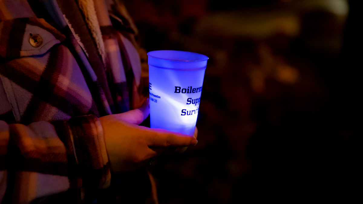A light from the care domestic violence walk on campus.