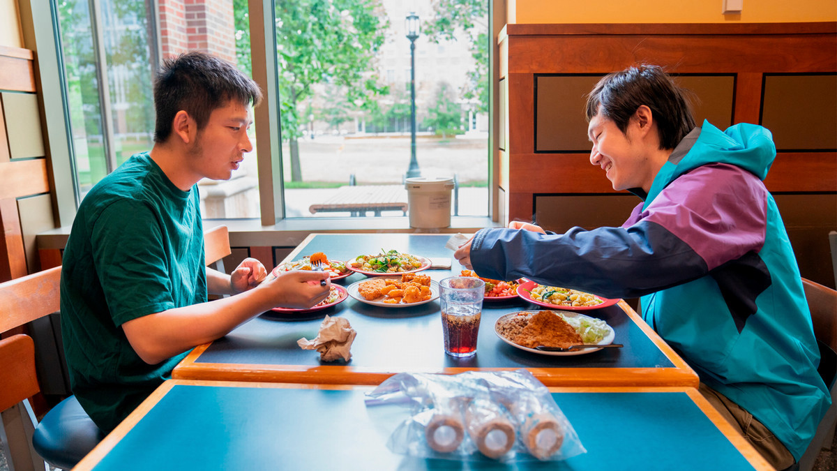 Two students eating at Wiley dining court.
