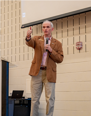 Patrick Mosher giving a presentation on stage