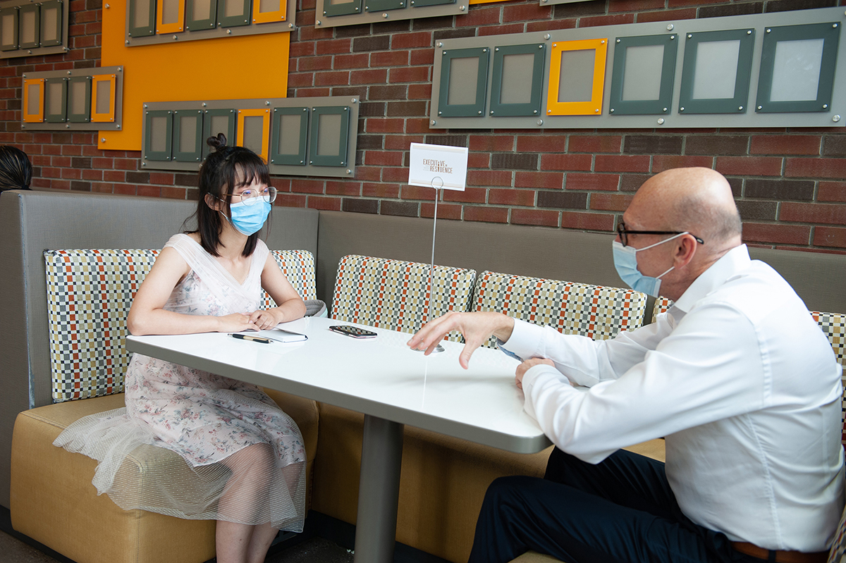 Rick Brajer meets with a student during Coffee & Consulting.