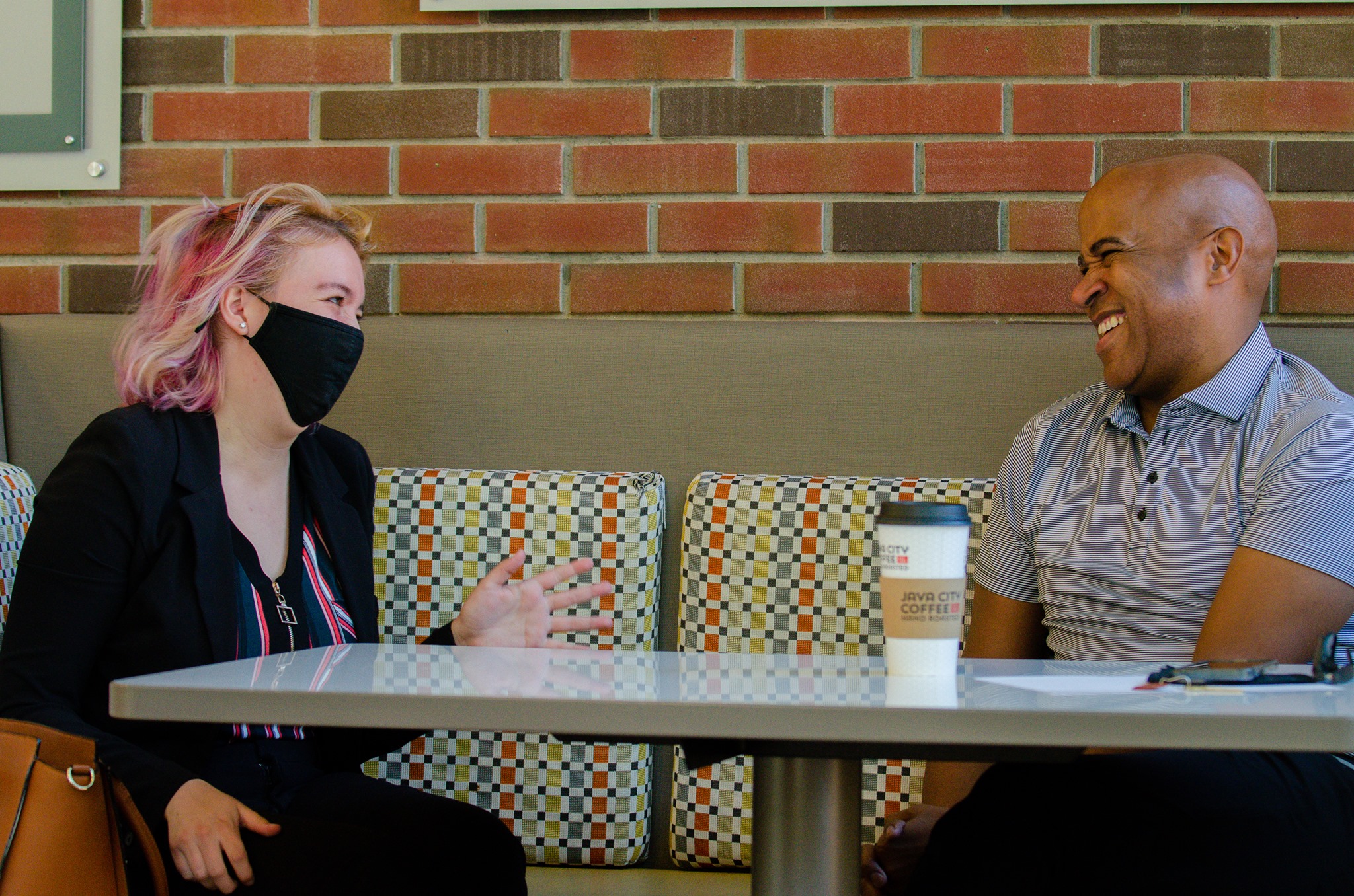 Rodrick Glass shares a laugh during Coffee & Consulting.