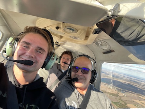 Ron Morgan (right) enjoys his flight with Purdue student pilots from Harrison Hall.