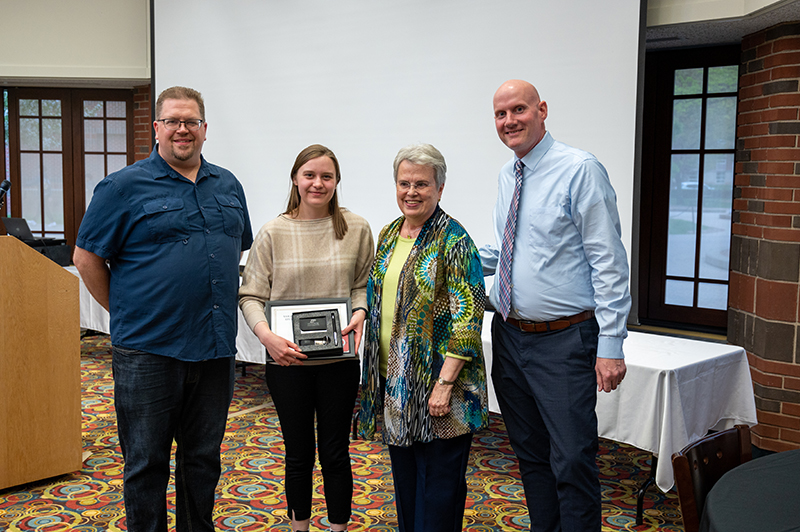 Jillian Pruss, winner of the Sarah Johnson Outstanding Student Employee of the Year award, with Eric Coates, Sarah Johnson and Kyle Linback.