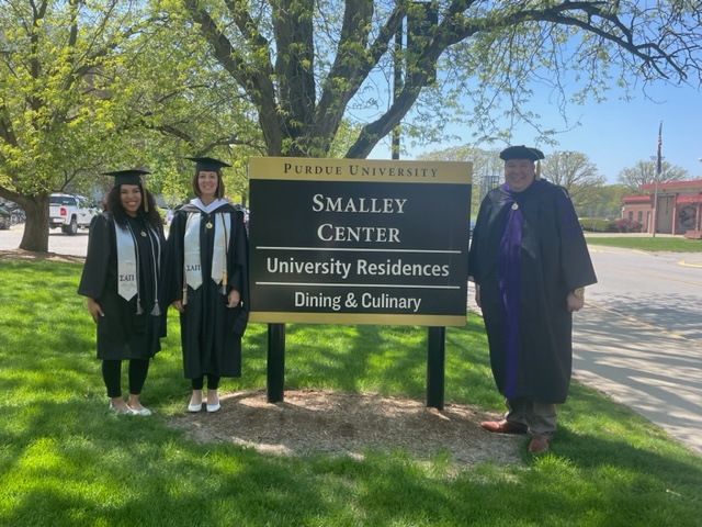 Jordan Richards, Autumn Cummings and Lee Morrison in front of Smalley Center.