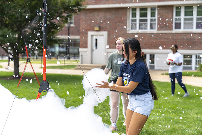 Students play in bubbles and foam at RHA Day