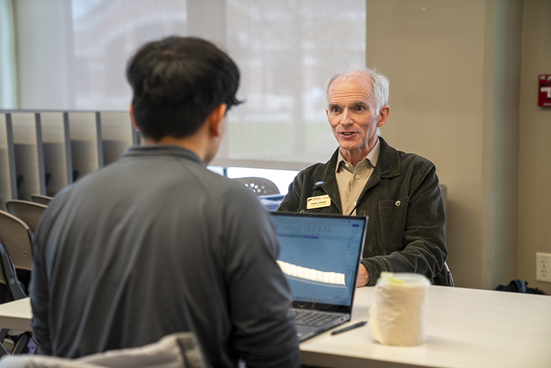 Patrick Mosher chats one-on-one with a student during an EiR event.
